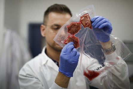 a food engineer inspects vacuum-sealed cultured steak at redefine meat ltd in ness ziona israel