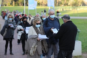 People present their coronavirus vaccination certificate or ‘green badge’ at a concert in Tel Aviv, Israel.