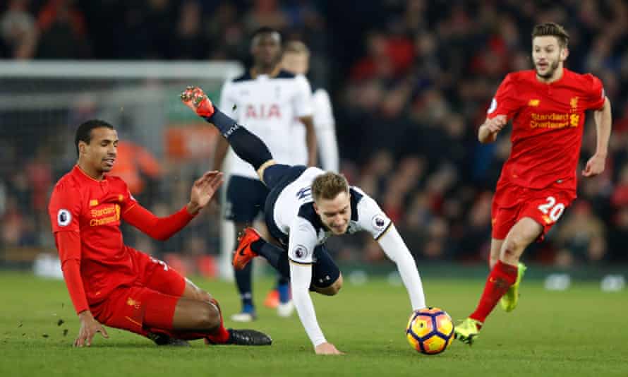 Liverpool’s Joel Matip brings down Tottenham’s Christian Eriksen.