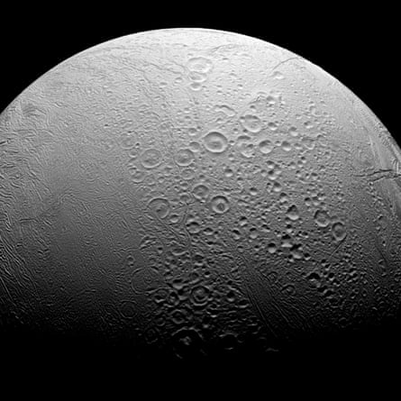 A photo of a grey moon pockmarked with craters