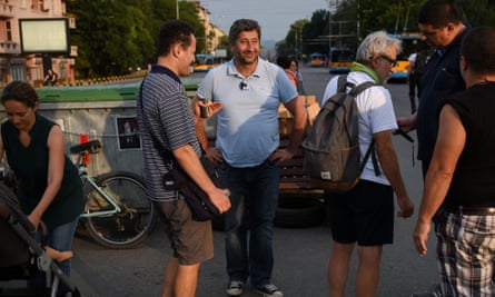 Hristo Ivanov speaks with protesters at a blocked crossroads in Sofia