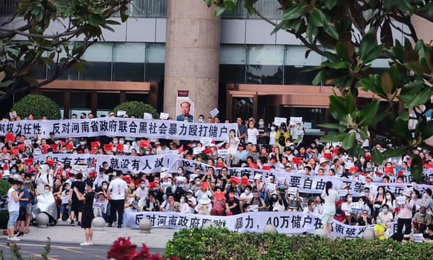 Protest in China over frozen bank accounts ends in violence | China | The  Guardian