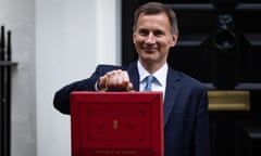 jeremy hunt holds up the famous red budget briefcase