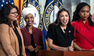 The four women, standing in a line on a podium, elected to Congress in 2018.