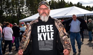 A Trump supporter wears a shirt that reads