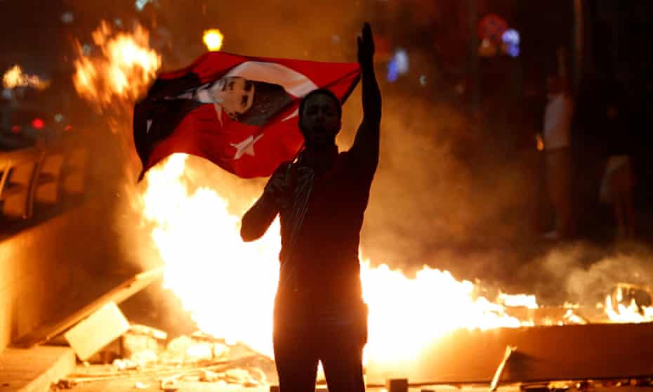 A Turkish man protests against the government of Erdoğan.