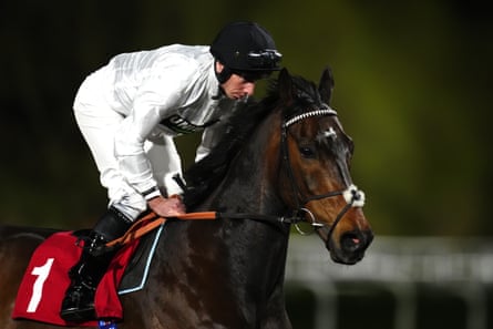 Constitution Hill and Ryan Moore riding to post ahead of the Virgin Bet Novice Stakes at Kempton Park Racecourse in March.
