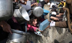 Palestinians, including a young child, hold out containers and look in despair as they line up in hopes of receiving food