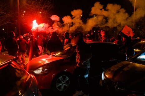 Moroccan fans celebrate in the Champs Elysees in Paris after the quarter-final victory over Portugal.
