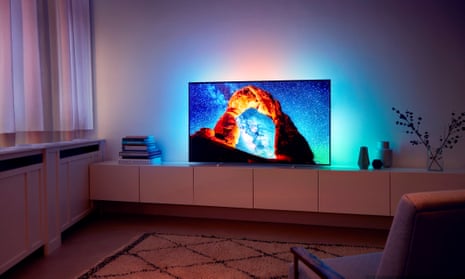 a philips oled 803 on a low sideboard in an uncluttered living room