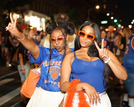 Two women in sunglasses celebrate the Knicks’ victory in New York, 13 June 2026.