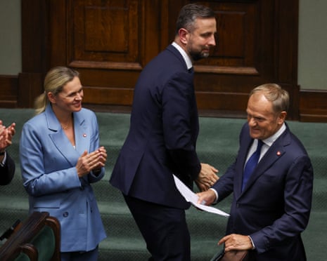 Polish prime minister Donald Tusk reacts after responding to parliamentary inquiries, on the day a vote of confidence is scheduled for his coalition government, in Warsaw, Poland.