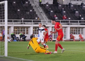 Kieffer Moore of Wales opens the scoring from close range.