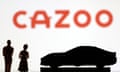 an illustration incorporating the red Cazoo brand sign with figurines of a car and people silhouetted in the foreground