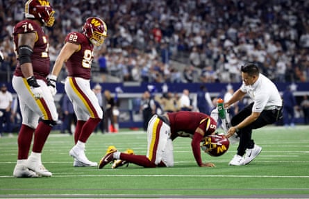 Jayden Daniels falls to the ground after his injury on Sunday.