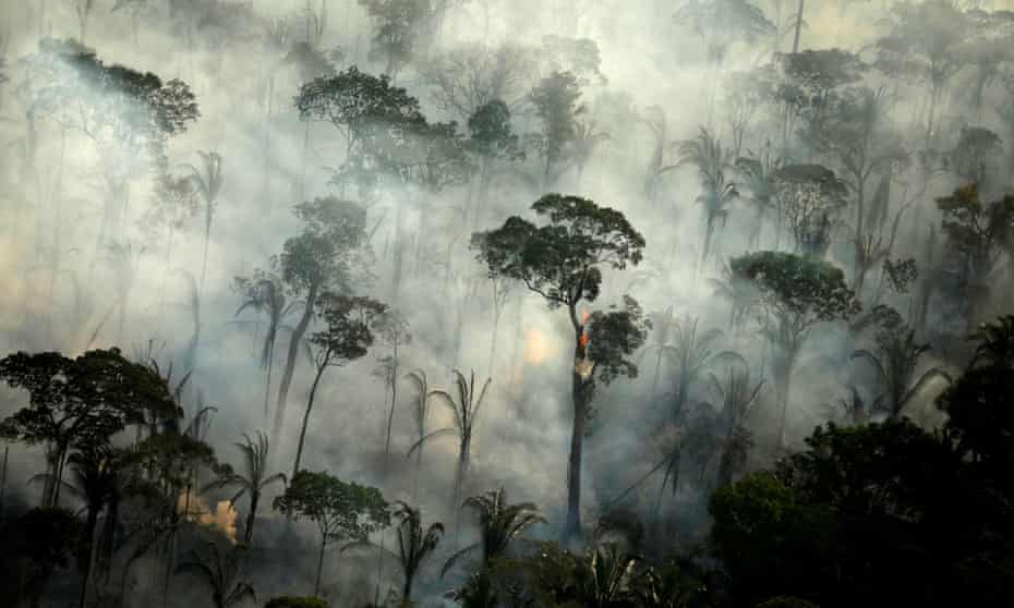 Smoke billows from a fire in an area of the Amazon rainforest near Porto Velho, Rondonia State, Brazil, September 2019.