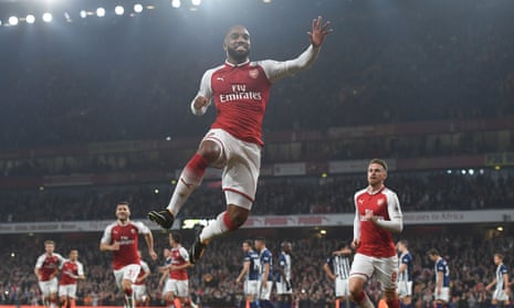 Alexandre Lacazette takes to the skies in celebration of his early goal against West Bromwich Albion.