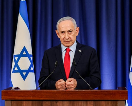 The Israeli prime minister, Benjamin Netanyahu, speaks during a press conference in Jerusalem, at a lectern with the Israeli flag behind him