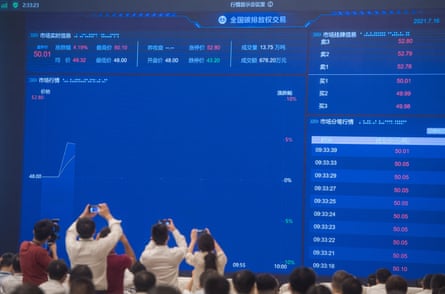 A screen displaying real-time information about carbon emission trading in Wuhan, China