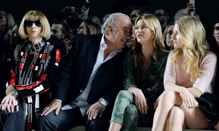 Anna Wintour, Sir Philip Green, Kate Moss and Lottie Moss attend the Topshop Unique show at London Fashion Week AW14 at Tate Modern in 2014.