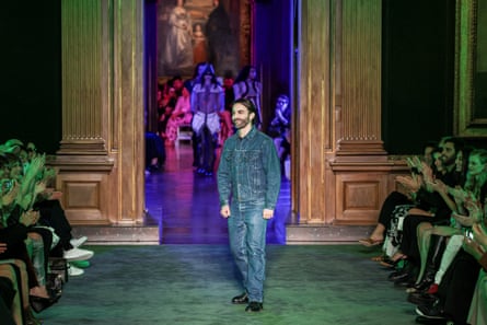Nicolas Ghesquière greets the crowd after his show