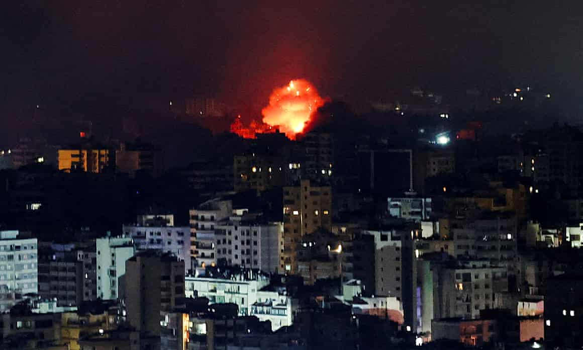 Fire and smoke rise over Beirut's southern suburbs after Israeli bombing.