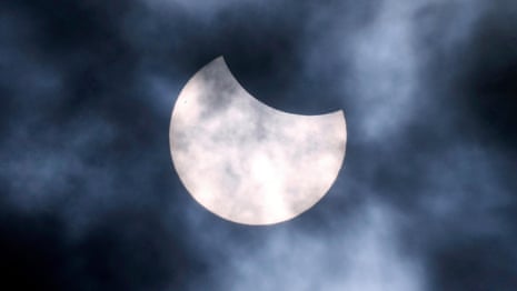 Skygazers acquire throughout northern hemisphere to glimpse partial sun eclipse Skygazers acquire throughout northern hemisphere to glimpse partial sun eclipse
