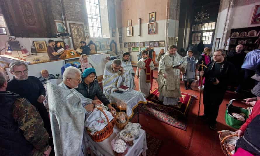 Ukrainian believers attend an Orthodox Easter mass with baskets of painted eggs and kulichi, a traditional Easter cake, in the Eastern Ukrainian city of Kharkiv amid the Russian invasion.