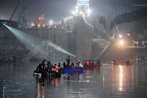 People in boats search the river
