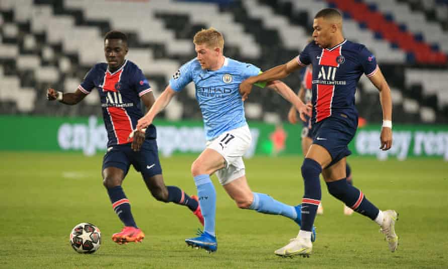 Kevin De Bruyne surges away from Idrissa Gueye and Kylian Mbappé during a masterful Champions League performance at PSG.