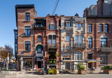 A row of three and four storey brick houses.