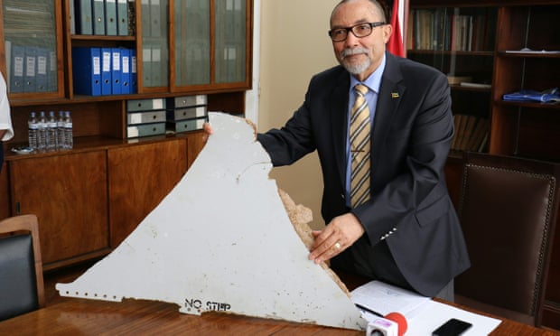 Joao de Abreu, president of Mozambique’s Civil Aviation Institute, holds a piece of aircraft wreckage found off the coast of Mozambique