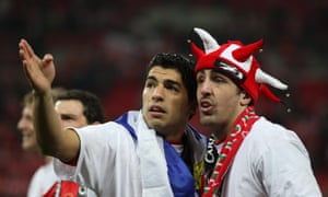 Luis Suárez and José Enrique during the celebrations following Liverpool’s victory over Cardiff City in the 2012 Carling Cup final