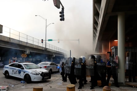 Police in riot gear use teargas at a rally in response to the recent death of George Floyd on 30 May 2020 on the streets of downtown Miami, Florida.