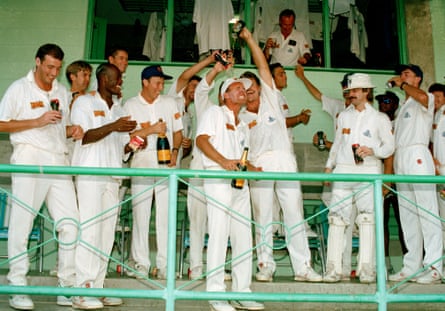 Chris Lewis, third from left, celebrates with England team-mates including Alec Stewart after England beat West Indies in the fourth Test in Barbados in April 1994.