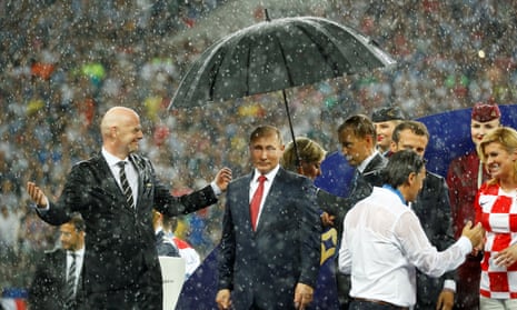 Infantino, Macron, Grabar-Kitarović: no brolly for you.