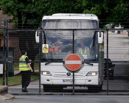 A coach carrying new arrivals at the gates of the Manston facility