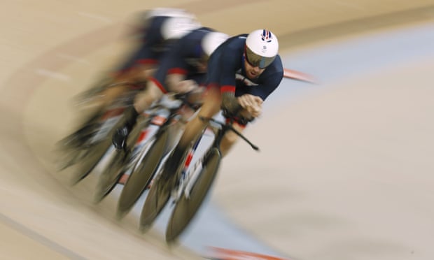 Bradley Wiggins, Owain Doull, Edward Clancy and Steven Burke compete in the men’s team pursuit finals track cycling event at the Velodrome.