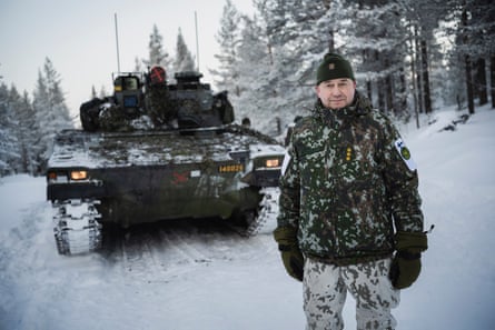 Col Marko Kivelä stands in front of a tank
