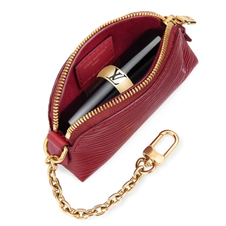 An LV monogrammed rouge cosmetic lipstick pouch