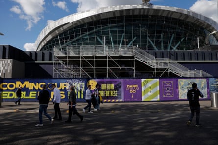 Fans make their way into the stadium past new building works at the Park Land end of the ground