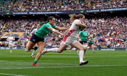 Abby Dow evades Ireland’s Katie Corrigan to score a try.