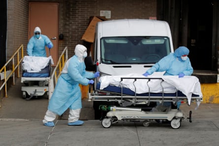 Healthcare workers wheel the bodies of deceased people from the Wyckoff Heights Medical Center during the outbreak of the coronavirus disease (COVID-19) in the Brooklyn borough of New York City.