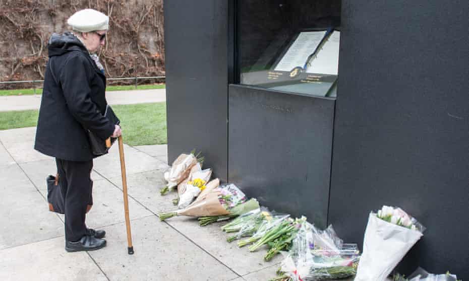 A woman pays her respects at the National Police Memorial, Westminster, on 23 March