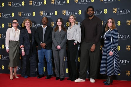 Bafta CEO Jane Millichip, chair of Bafta Sara Putt, actor David Jonsson, actor Aimee Lou Wood, chair of the film committee Emily Stillman, deputy chair of the film Committee Anthony Andrews and executive director of awards and content Emma Baehr arrive at the ceremony.