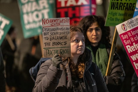 Activists gathered at Downing street to protest against expected austerity measures in the budget.