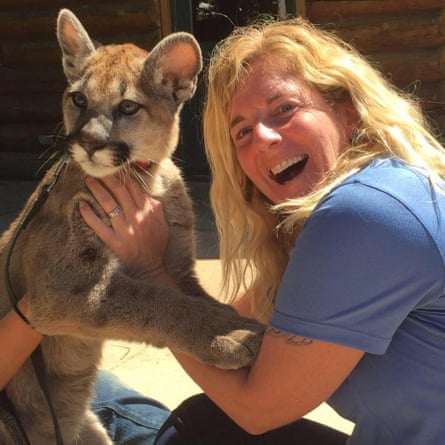A woman and a mountain lion cub