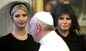 The pontiff walks past Ivanka and Melania Trump.