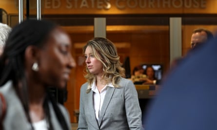 Elizabeth Holmes leaves court in San Jose in 2019.