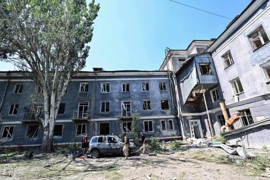 A wider view of the courtyard between the Hotel Industria and civilian buildings after an air strike which the regional governor claims has taken at least one live and injured six others.